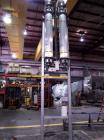 Used APV Vertical Scraped Surface Heat Exchanger System, 316 stainless steel. Consisting of: (2) APV scraped surface heat exchangers, model V884WWNN, 14.5 square feet heating surface per tube, 29 tot...