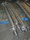 Used APV Vertical Scraped Surface Heat Exchanger System, 316 stainless steel. Consisting of: (2) APV scraped surface heat exchangers, model V884WWNN, 14.5 square feet heating surface per tube, 29 tot...