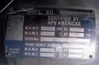 Used APV Vertical Scraped Surface Heat Exchanger System, 316 stainless steel. Consisting of: (2) APV scraped surface heat exchangers, model V884WWNN, 14.5 square feet heating surface per tube, 29 tot...
