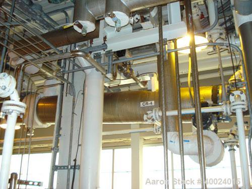 Used: Atlas shell and tube heat exchanger, approx 168 square feet, horizontal. Carbon steel shell rated 100 psi at 300 deg.f.,(97) 3/4" diameter x 9' long hastelloy C-22 tubes rated F.V. and 100 psi ...