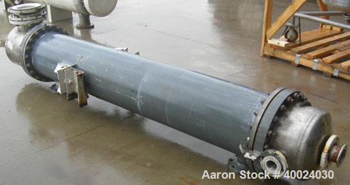 Used: Atlas shell and tube heat exchanger, approx 234 square feet, vertical. Carbon steel shell rated 100 psi at 300 deg.f.,(163) 3/4" diameter x 7'6" long hastelloy C-22 tubes rated F.V. and 100 psi...