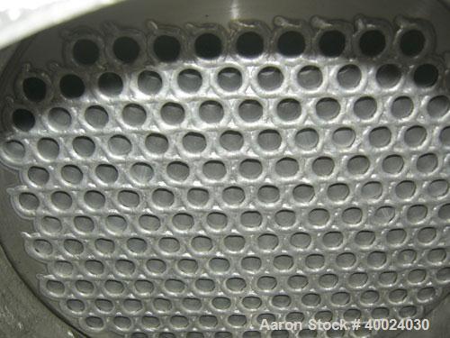 Used: Atlas shell and tube heat exchanger, approx 234 square feet, vertical. Carbon steel shell rated 100 psi at 300 deg.f.,(163) 3/4" diameter x 7'6" long hastelloy C-22 tubes rated F.V. and 100 psi...