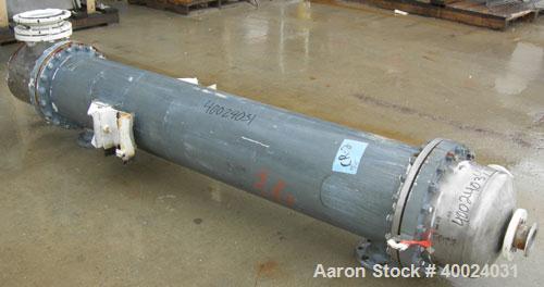 Used: Atlas shell and tube heat exchanger, approx 234 square feet, vertical. Carbon steel shell rated 100 psi at 300 deg.f.,(163) 3/4" diameter x 7'6" long hastelloy C-22 tubes rated F.V. and 100 psi...
