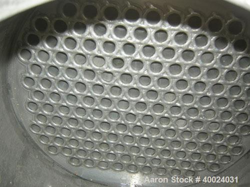 Used: Atlas shell and tube heat exchanger, approx 234 square feet, vertical. Carbon steel shell rated 100 psi at 300 deg.f.,...