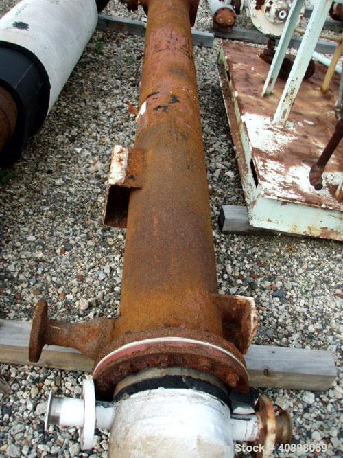 Used Titanium Industries Shell and Tube Heat Exchanger, 166 square feet, horizontal. Zirconium 702 tubes, tube sheets and bonnets with (85) 3/4" diameter x 10' long tubes rated 75 psi and full vacuum...