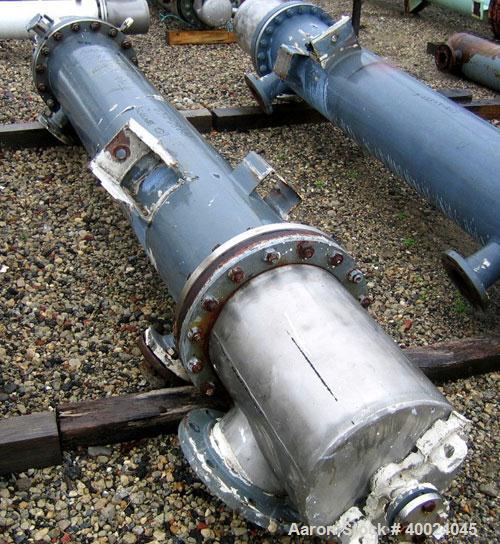 Used Atlas Shell and Tube Heat Exchanger, approximatelly 152 square feet, vertical, type BEM14-81. Carbon steel shell rated 100 psi at 300 deg F, (120) 3/4" diameter x 81" long Hastelloy C22 tubes ra...