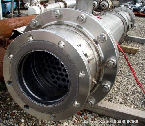 Used AstroCosmo Shell and Tube Heat Exchanger, 150 square feet , horizontal.Tantalum tubes, tube sheets and bonnets with (80) 3/4" diameter x 9' 6" long tubes rated 150 psi and full vacuum at 350 deg...