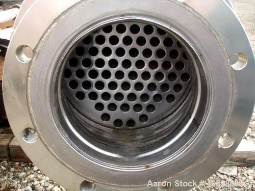 Used AstroCosmo Shell and Tube Heat Exchanger, 150 square feet , horizontal.Tantalum tubes, tube sheets and bonnets with (80) 3/4" diameter x 9' 6" long tubes rated 150 psi and full vacuum at 350 deg...