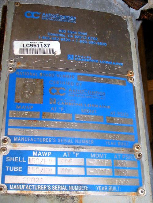 USED: Astrocosmos shell and tube heat exchanger, 123 square feet, vertical. Carbon steel shell rated 150 psi/FV at 400 deg F, tantalum tubes rated 150 psi/FV at 400 deg F. Built 1999.