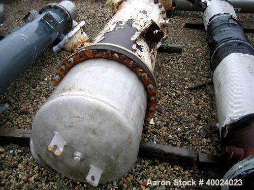 Used Atlas Shell and Tube Heat Exchanger, approximately 411 square feet, vertical. Type BEM22-72. Carbon steel shell rated 100 psi at 300 deg F, (350) 3/4'' diameter x 6' long Hastelloy C-22 tubes ra...