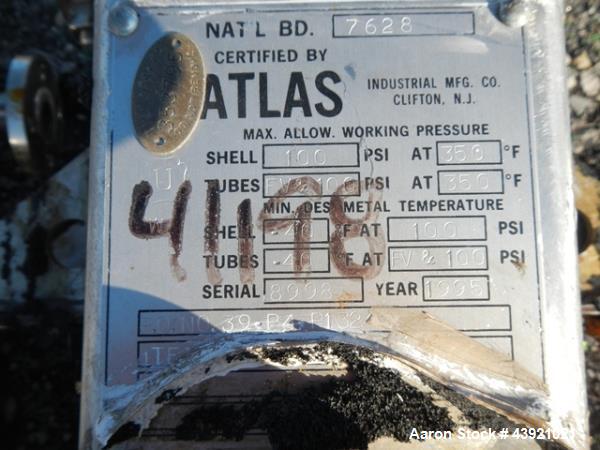 Used Atlas heat exchanger, 13 sq ft hastelloy C276 tubes, tube sheets and bonnets with (55) .75" diameter x 15" long tubes rated, rated 100 psi and full vacuum at 350 F, 304L stainless steel shell ra...