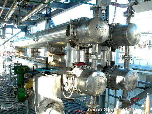 USED: Atlas four pass shell and tube heat exchanger, 561 square feet, horizontal. Hastelloy C276 shell rated FV and 150 psi at 400 deg F, (144) 3/4" diameter x 20' long Hastelloy C276 tubes rated FV ...