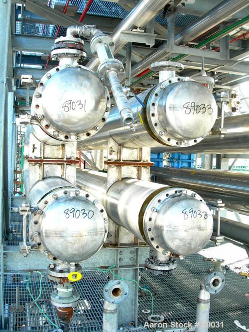 USED: Atlas four pass shell and tube heat exchanger, 561 square feet, horizontal. Hastelloy C276 shell rated FV and 150 psi at 400 deg F, (144) 3/4" diameter x 20' long Hastelloy C276 tubes rated FV ...