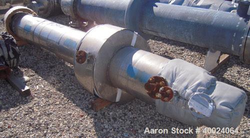 Used Atlas Single Pass Shell and Tube Heat Exchanger, 102 square feet, horizontal, type BEM10-120. Carbon steel shell rated 100 psi at 300 deg F, carbon steel baffles and expansion ring. (52) 3/4" di...