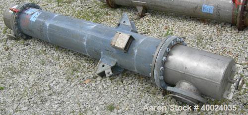 Used: Atlas shell and tube heat exchanger, approx 154 square feet, vertical. Carbon steel shell rated 100 psi at 300 deg.f.,...