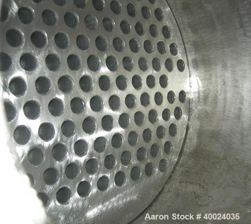 Used: Atlas shell and tube heat exchanger, approx 154 square feet, vertical. Carbon steel shell rated 100 psi at 300 deg.f.,(120) 3/4" diameter x 6'8" long hastelloy C-22 tubes rated F.V. and 100 psi...