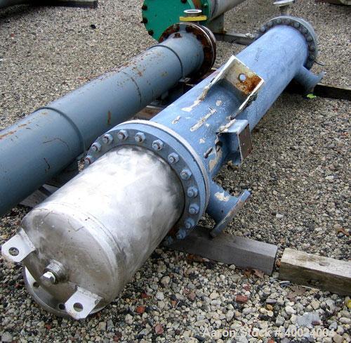 Used Atlas Shell and Tube Heat Exchanger, 167 square feet, vertical. Type BEM14-84.  Carbon steel shell rated 100 psi at 300 deg F, (122) 3/4" diameter x 7' long Hastelloy C22 tubes rated F.V. and 10...