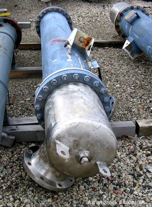 Used Atlas Shell and Tube Heat Exchanger, 167 square feet, vertical. Type BEM14-84.  Carbon steel shell rated 100 psi at 300 deg F, (122) 3/4" diameter x 7' long Hastelloy C22 tubes rated F.V. and 10...