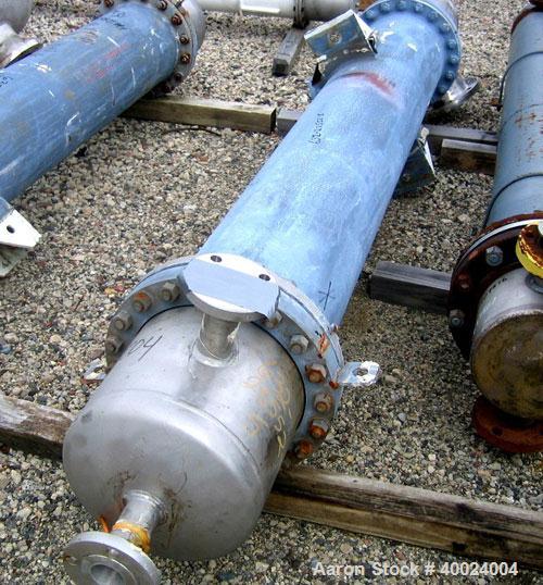 Used Atlas Shell and Tube Heat Exchanger, 167 square feet, vertical. Type BEM14-84.  Carbon steel shell rated 100 psi at 300 deg F, (122) 3/4" diameter x 7' long Hastelloy C22 tubes rated F.V. and 10...