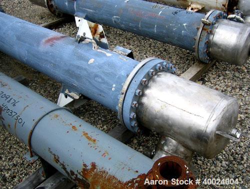 Used Atlas Shell and Tube Heat Exchanger, 167 square feet, vertical. Type BEM14-84.  Carbon steel shell rated 100 psi at 300 deg F, (122) 3/4" diameter x 7' long Hastelloy C22 tubes rated F.V. and 10...