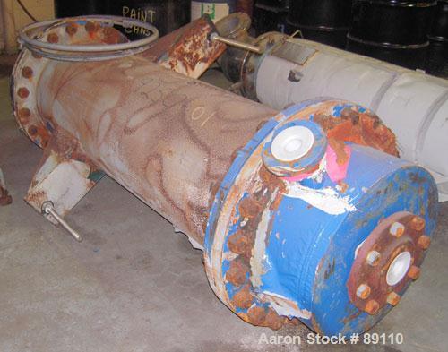 Used Cosmos Shell And Tube Heat Exchanger, 215 Square Feet, Type BEM 20-1-60, Vertical. Carbon steel shell rated 150 psi/FV at 400 deg F, tantalum tubes rated 150 psi/FV at 400 deg F.