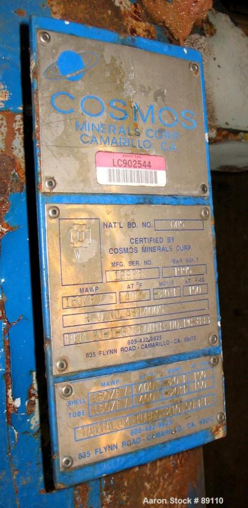 Used Cosmos Shell And Tube Heat Exchanger, 215 Square Feet, Type BEM 20-1-60, Vertical. Carbon steel shell rated 150 psi/FV at 400 deg F, tantalum tubes rated 150 psi/FV at 400 deg F.