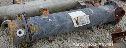 Used Cosmos Single Pass Shell And Tube Heat Exchanger, 123 square feet, vertical. Carbon steel shell rated 150 psi/FV at 400 deg F, (106) 3/4" diameter x 6' long tantalum tubes rated 150 psi at 400 d...
