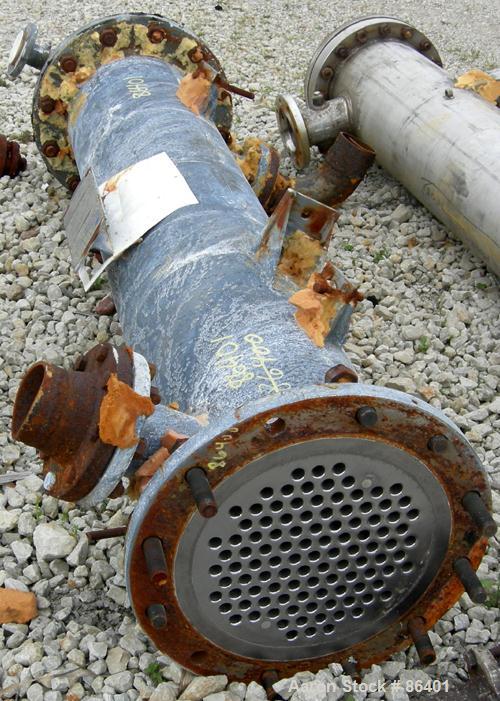 Used Cosmos Single Pass Shell And Tube Heat Exchanger, 123 square feet, vertical. Carbon steel shell rated 150 psi/FV at 400 deg F, (106) 3/4" diameter x 6' long tantalum tubes rated 150 psi at 400 d...