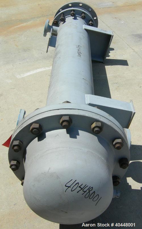 Unused- Cosmos Minerals multiple pass shell and tube heat exchanger, 34.5 square feet, horizontal. Carbon steel shell rated 90 psi at 320 deg F, (32) 3/4" diameter x 66" long tantalum tubes rated 90 ...