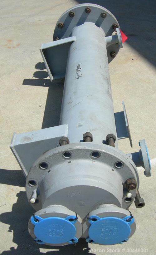 Unused- Cosmos Minerals multiple pass shell and tube heat exchanger, 34.5 square feet, horizontal. Carbon steel shell rated 90 psi at 320 deg F, (32) 3/4" diameter x 66" long tantalum tubes rated 90 ...