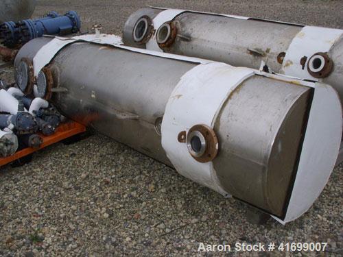 Used Doyle & Roth Shell and Tube Heat Exchanger, 495 square feet, horizontal. 304 stainless steel shell rated 150 psi at 350 deg F and –20 deg F at 150 psi. (421) 3/4" diameter x 6' long Hastelloy C2...