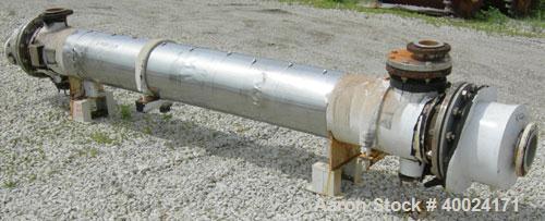 Used Futura Titanium Corporation Single Pass Shell and Tube Heat Exchanger, 319 Square Feet, Horizontal. Type BEM 14-2-144. 316L stainless steel shell rated 60 psi/FV at 350 deg F. (140) 3/4" diamete...
