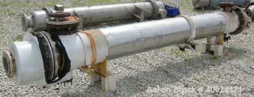 Used Futura Titanium Corporation Single Pass Shell and Tube Heat Exchanger, 319 Square Feet, Horizontal. Type BEM 14-2-144. 316L stainless steel shell rated 60 psi/FV at 350 deg F. (140) 3/4" diamete...