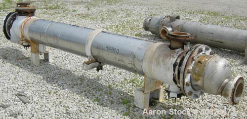 Used Futura Titanium Corporation Single Pass Shell and Tube Heat Exchanger, 319 Square Feet, Horizontal. Type BEM 14-2-144. 316L stainless steel shell rated 60 psi/FV at 350 deg F. (140) 3/4" diamete...