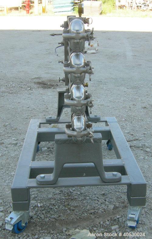 Used Tubular Heat Exchanger, approximately 12 square feet, copper nickel C710/80-20 construction. 1 1/2" diameter pipe, (6) banks 48" long, (2) banks 53 1/2" long. (2) manifolds. Tri-clamp inlet/outl...