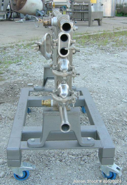 Used Tubular Heat Exchanger, approximately 12 square feet, copper nickel C710/80-20 construction. 1 1/2" diameter pipe, (6) banks 48" long, (2) banks 53 1/2" long. (2) manifolds. Tri-clamp inlet/outl...