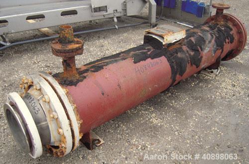 Used Titanium Industries Shell and Tube Heat Exchanger, 151 square feet, horizontal. Tema Type BEM, Tema Size 14-72. Carbon steel shell rated 75 psi at 350 deg F, (129 ) 3/4'' diameter x 6' long Zirc...