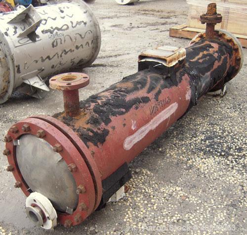 Used Titanium Industries Shell and Tube Heat Exchanger, 151 square feet, horizontal. Tema Type BEM, Tema Size 14-72. Carbon steel shell rated 75 psi at 350 deg F, (129 ) 3/4'' diameter x 6' long Zirc...