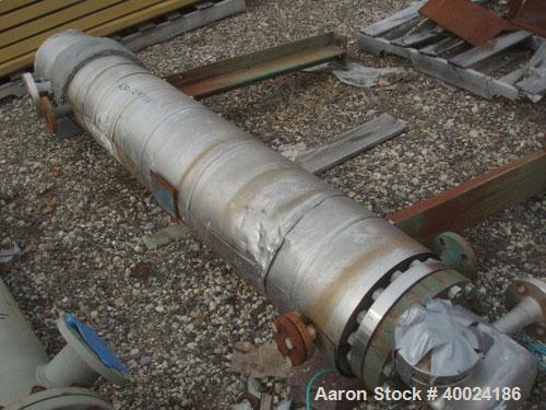 Used Yula Corporation Shell And Tube Heat Exchanger, 49 square feet, horizontal, model WC-1C-72BS. Carbon steel shell rated 150 psi at 350 deg F, (42) 3/4" diameter x 6' long Hastelloy C-276 tubes ra...