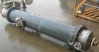 Used: Atlas shell and tube heat exchanger, approx 234 square feet, vertical. Carbon steel shell rated 100 psi at 300 deg.f.,(163) 3/4