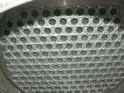 Used: Atlas shell and tube heat exchanger, approx 234 square feet, vertical. Carbon steel shell rated 100 psi at 300 deg.f.,(163) 3/4