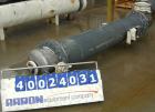 Used: Atlas shell and tube heat exchanger, approx 234 square feet, vertical. Carbon steel shell rated 100 psi at 300 deg.f.,(163) 3/4