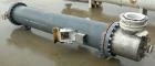 Used: Atlas shell and tube heat exchanger, approx 234 square feet, vertical. Carbon steel shell rated 100 psi at 300 deg.f.,(163) 3/4