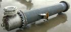 Used: Atlas shell and tube heat exchanger, approx 234 square feet, vertical. Carbon steel shell rated 100 psi at 300 deg.f.,(163) 3/4