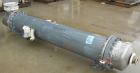 Used: Atlas shell and tube heat exchanger, approx 234 square feet, vertical. Carbon steel shell rated 100 psi at 300 deg.f.,(163) 3/4