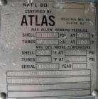 Used: Atlas shell and tube heat exchanger, approx 234 square feet, vertical. Carbon steel shell rated 100 psi at 300 deg.f.,(163) 3/4