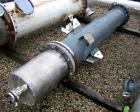 Used Atlas Shell and Tube Heat Exchanger, approximatelly 152 square feet, vertical, type BEM14-81. Carbon steel shell rated 100 psi at 300 deg F, (120) 3/4