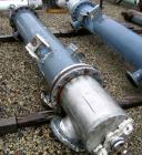 Used Atlas Shell and Tube Heat Exchanger, approximatelly 152 square feet, vertical, type BEM14-81. Carbon steel shell rated 100 psi at 300 deg F, (120) 3/4