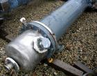 Used Atlas Shell and Tube Heat Exchanger, approximatelly 152 square feet, vertical, type BEM14-81. Carbon steel shell rated 100 psi at 300 deg F, (120) 3/4