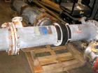 USED: Astrocosmos shell and tube heat exchanger, 123 square feet, vertical. Carbon steel shell rated 150 psi/FV at 400 deg F, tantalum tubes rated 150 psi/FV at 400 deg F. Built 1999.